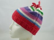 Free knitting pattern for childs stripy hat with tie top